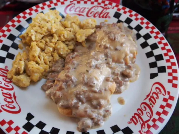 homemade country sausage gravy recipe with flaky biscuits